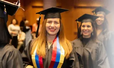 Herzing Nebraska Online BSN Student Smiling at Graduation Ceremony